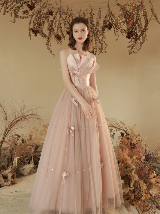 Elegant Blush Pink Strapless Tulle Ball Gown with Bow Accents