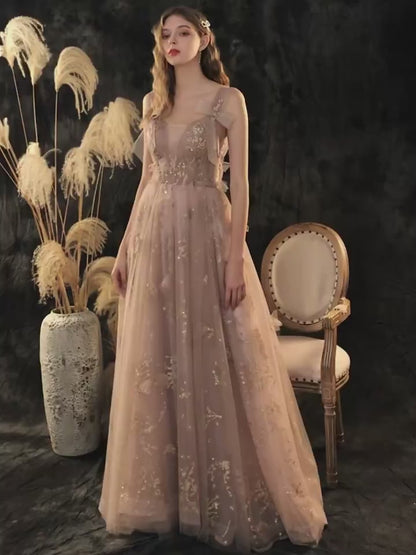 Elegant roséguld glitter tyll aftonklänning med rosettdetaljer